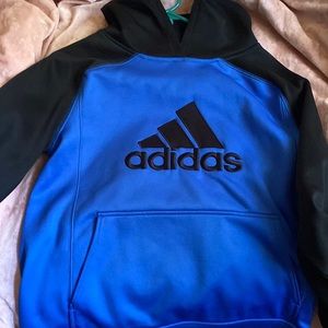 A blue adidas sweater